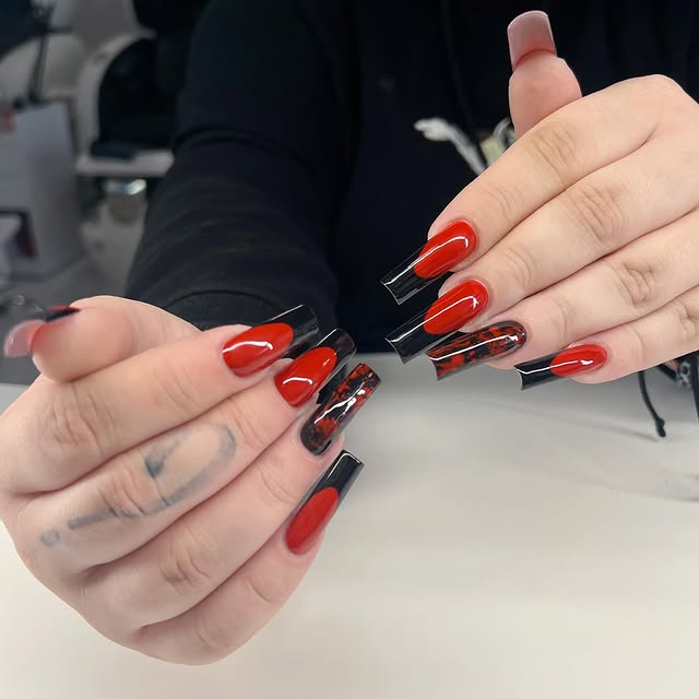 Bold red nail art at Binhs Nail Meadowlark